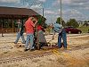 Doug Blodgett scrapes the concrete